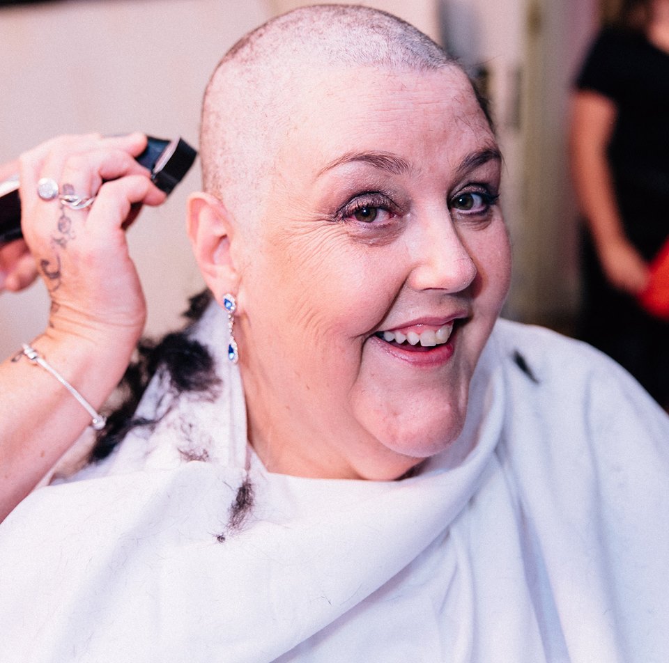 Pamela Dungey shaving the hair.