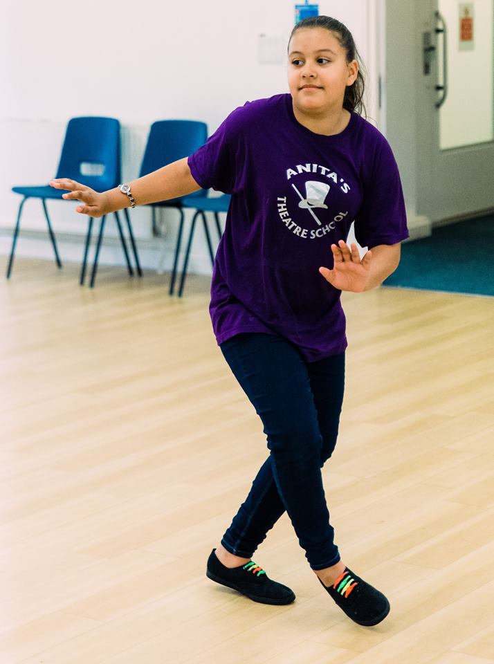 Girl learning how to do some dance steps.