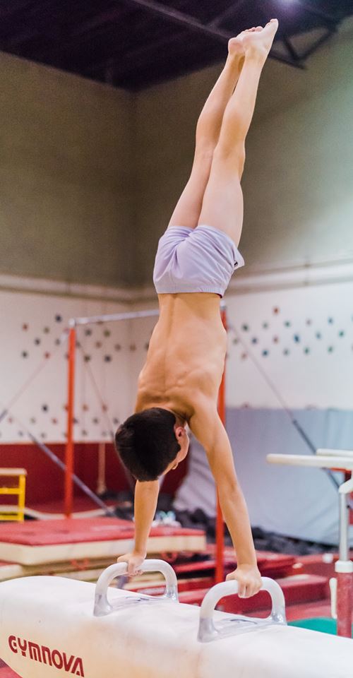 Boy doing a pin.
