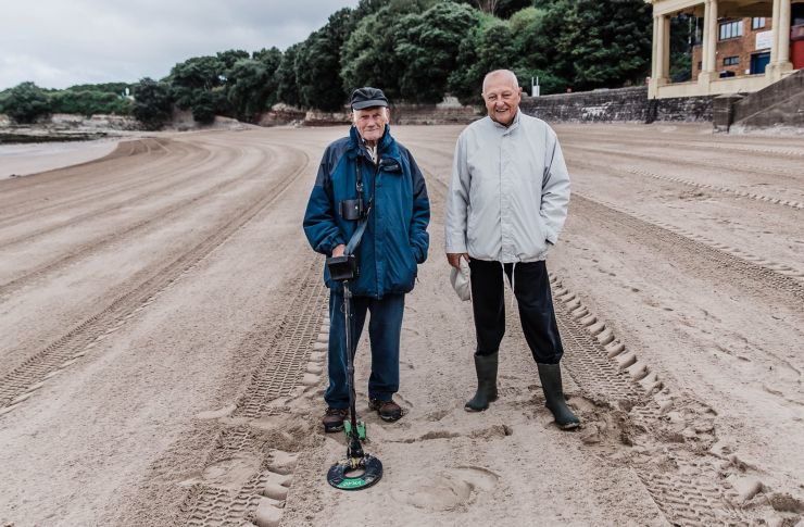 Kevin Moore captures Mr vivian phillips at barry island beach doing what he loves, metal detecting
