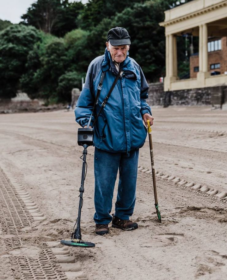 Kevin Moore captures Mr vivian phillips at barry island beach doing what he loves, metal detecting